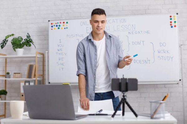 adult teacher teaching in classroom